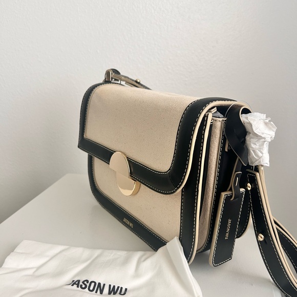 Jason Wu
Orbit Canvas / Leather Shoulder Bag NWT Color Beige/ Black - Picture 7 of 14